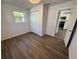 Bedroom with wood floors, closet and access to kitchen at 1921 Nw 12Th St, Ocala, FL 34475