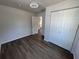 Bright bedroom features modern wood floors and a spacious closet at 1921 Nw 12Th St, Ocala, FL 34475