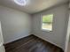 Cozy bedroom with wood floors and a bright window at 1921 Nw 12Th St, Ocala, FL 34475