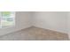 Comfortable bedroom with a window that provides natural light at 205 Lori Ct, Umatilla, FL 32784
