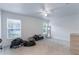 Expansive main bedroom with ceiling fan and natural light from two windows at 205 Lori Ct, Umatilla, FL 32784