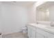 Bright bathroom featuring a double sink with white cabinetry at 2144 Hibiscus Pl, Kissimmee, FL 34759