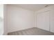 Cozy bedroom with plush carpeting, a closet, and a window offering natural light at 2144 Hibiscus Pl, Kissimmee, FL 34759