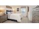 Calm bedroom with nautical decor, soft lighting, and a comfortable bed with stylish accents at 2144 Hibiscus Pl, Kissimmee, FL 34759