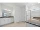 Bright bathroom features a double vanity, walk-in shower, and access to the toilet behind a closed door at 2152 Rock Maple Bnd, Kissimmee, FL 34746