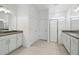 Bright bathroom featuring double vanity, walk-in shower, and wood-look tile flooring at 2152 Rock Maple Bnd, Kissimmee, FL 34746