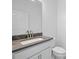 Bathroom with a marble countertop vanity and a large mirror at 2152 Rock Maple Bnd, Kissimmee, FL 34746