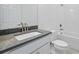 Clean bathroom features sleek vanity with gray countertop, and a bathtub at 2152 Rock Maple Bnd, Kissimmee, FL 34746