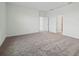 Spacious bedroom features carpet flooring, bright white walls, and two doorways at 2152 Rock Maple Bnd, Kissimmee, FL 34746