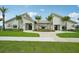 Inviting clubhouse featuring well-manicured landscaping, paver walk-way, and elegant architectural details at 2152 Rock Maple Bnd, Kissimmee, FL 34746