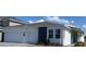 Charming single-story home featuring a clean white facade, stone accents, and a spacious three-car garage at 2152 Rock Maple Bnd, Kissimmee, FL 34746