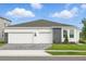 Charming single-Gathering home features a three-car garage, stone accents, and manicured landscaping at 2152 Rock Maple Bnd, Kissimmee, FL 34746