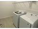 Conveniently located laundry room equipped with modern washer and dryer and shelving at 2152 Rock Maple Bnd, Kissimmee, FL 34746