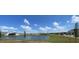 Scenic community view overlooking a tranquil pond and well-manicured green spaces at 2152 Rock Maple Bnd, Kissimmee, FL 34746