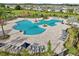 Community pool featuring an amazing view of the play area and plenty of seating at 2152 Rock Maple Bnd, Kissimmee, FL 34746