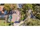 Aerial view of a well-maintained home showcases landscaping, pool, and private surroundings at 2155 Palm View Dr, Apopka, FL 32712