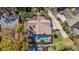 Aerial view shows the house's layout, landscaping, screened-in pool, and surrounding neighborhood at 2155 Palm View Dr, Apopka, FL 32712