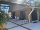 A covered back patio, featuring comfortable seating, extending living space outdoors at 2155 Palm View Dr, Apopka, FL 32712