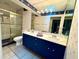 Bathroom with dual sinks, vanity, and a glass door shower at 2155 Palm View Dr, Apopka, FL 32712