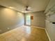Bedroom features neutral paint with fan and closet at 2155 Palm View Dr, Apopka, FL 32712