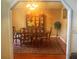 Formal dining room with hardwood floors and a decorative china cabinet at 2155 Palm View Dr, Apopka, FL 32712