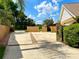 Long driveway leading to the home, enhanced by a stone column feature and complemented by mature landscaping at 2155 Palm View Dr, Apopka, FL 32712