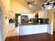 Bright kitchen with stainless steel appliances, granite counters, and stylish cabinets at 2155 Palm View Dr, Apopka, FL 32712