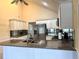 Well-lit kitchen featuring granite countertops and stainless steel appliances at 2155 Palm View Dr, Apopka, FL 32712