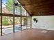 Spacious lanai with tile flooring, high ceilings, and views of the pool and outdoor area at 2155 Palm View Dr, Apopka, FL 32712
