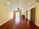 Open living room with hardwood floors, fireplace, and sliding door to pool at 2155 Palm View Dr, Apopka, FL 32712