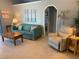 Relaxing living room featuring tile floors, vaulted ceilings, and comfortable seating at 2155 Palm View Dr, Apopka, FL 32712