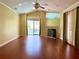 Bright living room with hardwood floors, fireplace, and view to pool at 2155 Palm View Dr, Apopka, FL 32712