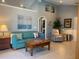 Inviting living room with vaulted ceilings, tile floors, and comfortable seating at 2155 Palm View Dr, Apopka, FL 32712