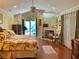 Cozy main bedroom with fireplace and view of the pool area at 2155 Palm View Dr, Apopka, FL 32712