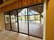 Enclosed patio offering indoor/outdoor living space with access to the pool at 2155 Palm View Dr, Apopka, FL 32712