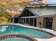 The sparkling screened-in pool and patio offers resort-style living and a place to entertain at 2155 Palm View Dr, Apopka, FL 32712