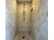 Modern shower with elegant tile work, a rainfall shower head, and built-in niche at 2155 Palm View Dr, Apopka, FL 32712