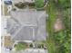 Aerial view of a home's roof and landscaping showing nearby community at 2256 Betsy Ross Ln, St Cloud, FL 34769