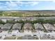 Aerial view showing a neighborhood of townhomes near a highway and open land at 2256 Betsy Ross Ln, St Cloud, FL 34769