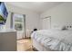 Bright bedroom with hardwood floors, a large window, and neutral tones for a relaxing space at 2256 Betsy Ross Ln, St Cloud, FL 34769