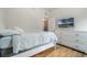 Bedroom featuring hardwood floors, a TV, and an ensuite bathroom for added convenience at 2256 Betsy Ross Ln, St Cloud, FL 34769