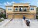 Charming multi-Gathering home featuring a second-story balcony and attached garages at 2256 Betsy Ross Ln, St Cloud, FL 34769