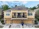 Inviting home featuring a balcony, well-manicured landscaping, and multi-car garages at 2256 Betsy Ross Ln, St Cloud, FL 34769
