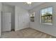 Bedroom featuring two windows, ceiling fan and closet, offering simple and comfortable living space at 2311 Victoria Dr, Davenport, FL 33837