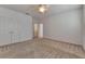 Spacious bedroom with neutral carpet, ceiling fan, and double door closet provides ample storage at 2311 Victoria Dr, Davenport, FL 33837
