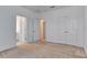 Bright bedroom with neutral carpet, ceiling fan, and ensuite bathroom access at 2311 Victoria Dr, Davenport, FL 33837