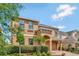 Charming two-story home with meticulously landscaped front yard and an attached two car garage at 2311 Victoria Dr, Davenport, FL 33837
