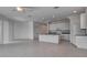 Spacious living area with tiled flooring, recessed lighting, ceiling fan, and open-concept kitchen at 2311 Victoria Dr, Davenport, FL 33837