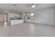 Expansive living space featuring tiled flooring, recessed lighting, ceiling fan, and open-concept kitchen at 2311 Victoria Dr, Davenport, FL 33837