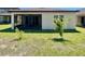 Spacious backyard with a screened lanai, perfect for outdoor dining and relaxation at 254 Alford Dr, Davenport, FL 33896